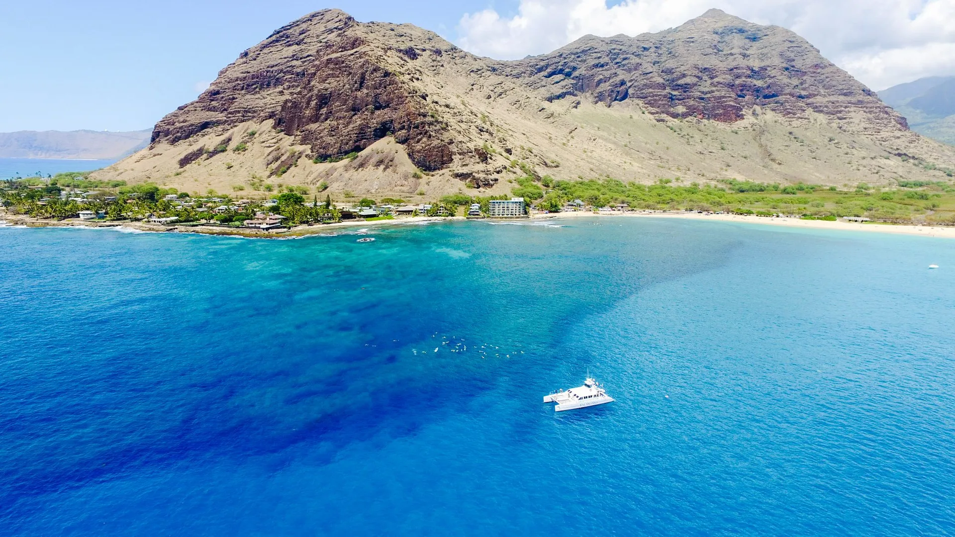 Catamaran & coast from the air