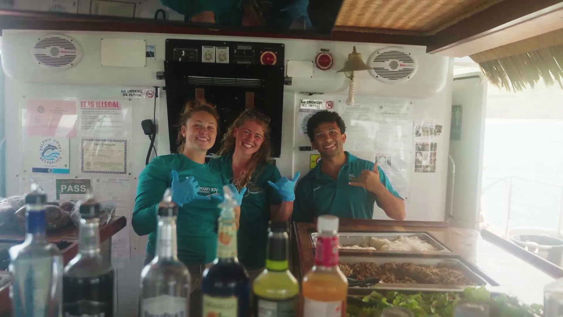 The crew serving the hot buffet at the galley