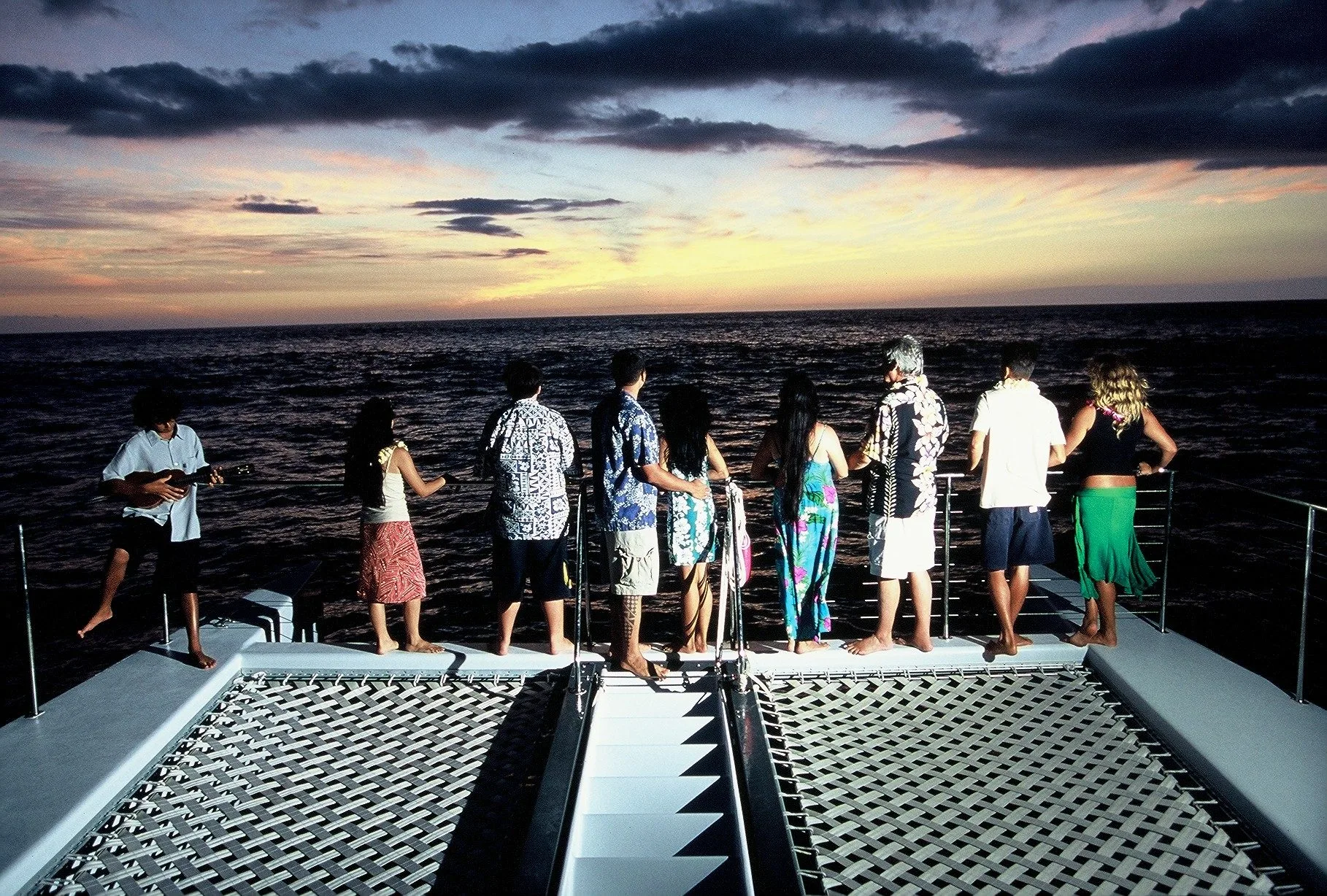 Guests on deck at sunset