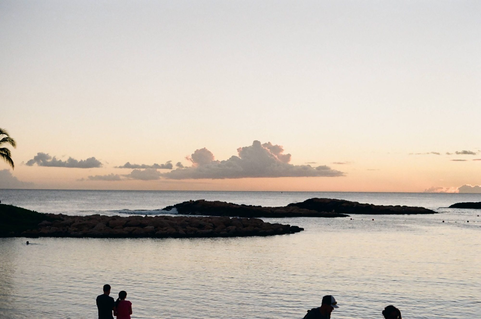 ko olina people-standing-on-the-coast-of-ko-olina-lagoons